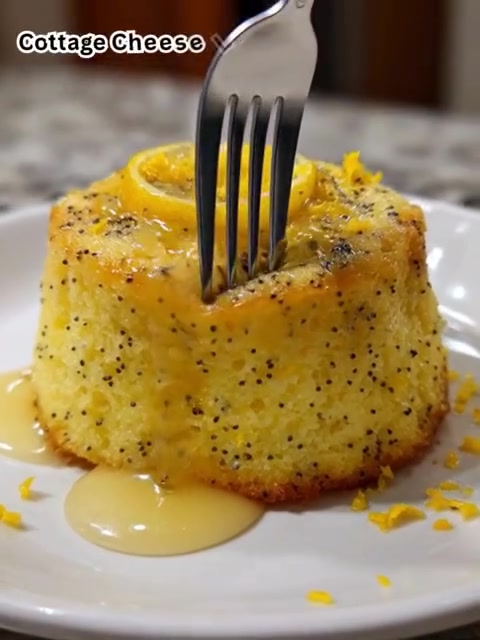 Cottage Cheese Lemon Poppy Seed Mug Cake 🍋🌼 – Quick, Healthy & Protein-Packed

Light, zesty, and ready in minutes, this single-serve cottage cheese mug cake is a healthy treat that feels indulgent. Soft, fluffy, and packed with protein — perfect for breakfast or a guilt-free dessert.

Ingredients (Makes 1 Mug Cake):
1/2 cup cottage cheese (120 g)
1 tablespoon lemon juice (15 ml)
1 teaspoon lemon zest
1 tablespoon honey (15 ml)
1/4 cup almond flour (25 g)
1 tablespoon poppy seeds (10 g)
1/4 teaspoon baking powder (1 g)
1/4 teaspoon vanilla extract (1.25 ml)
1 large egg
1/8 teaspoon salt
💪 Nutrition (Per Serving):
~250 kcal | 18g protein | 10g fat | 24g carbs
📌 Step-by-Step Instructions — just 5 min prep + 1 min cook!
Step 1: Combine Ingredients
In a microwave-safe mug, mix together the cottage cheese, lemon juice, lemon zest, honey, vanilla extract, and egg until smooth.
Step 2: Add Dry Ingredients
Stir in the almond flour, poppy seeds, baking powder, and salt until fully combined.
Step 3: Microwave
Cook in the microwave on high for about 1 minute, or until the cake has risen and is set in the center.
Step 4: Cool & Enjoy
Allow the mug cake to cool for a minute before enjoying straight from the mug or transferring to a plate.
Prep Time: 5 min | Cook Time: 1 min | Total: 6 min
Tips for Success:
Adjust microwave time based on your appliance’s power to achieve the perfect texture. Serve warm for the best flavor and fluffiness.